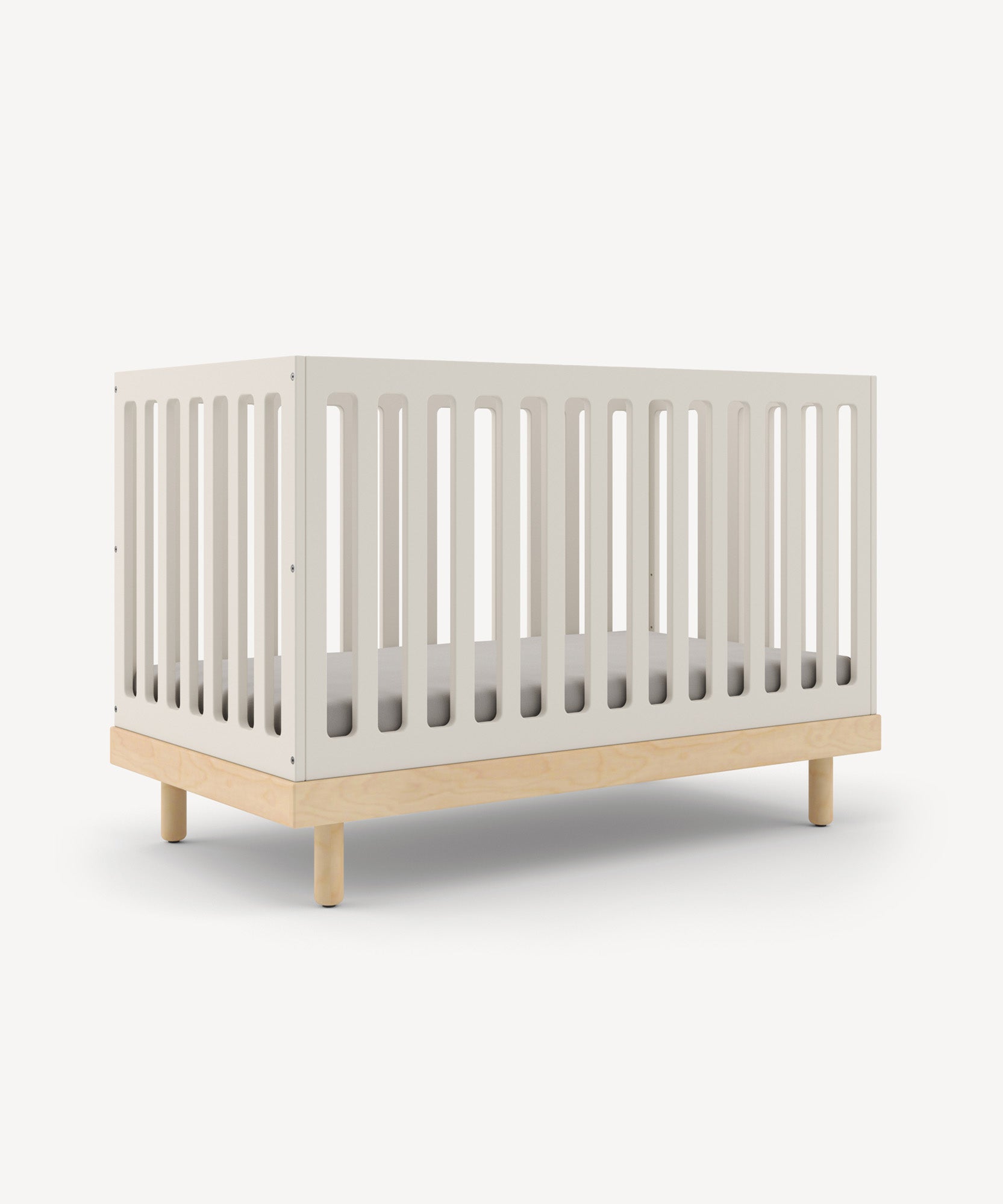 The Classic Crib features white slatted sides and a light brown base, set against a plain white background.