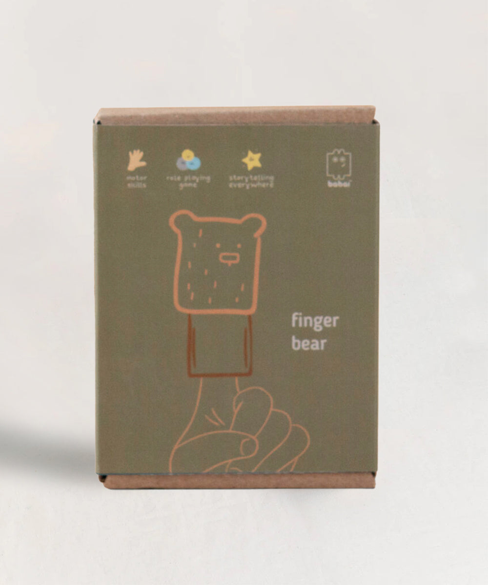 The Le Bear Finger Puppet box features a simple bear puppet design and includes icons and text promoting role playing and storytelling.