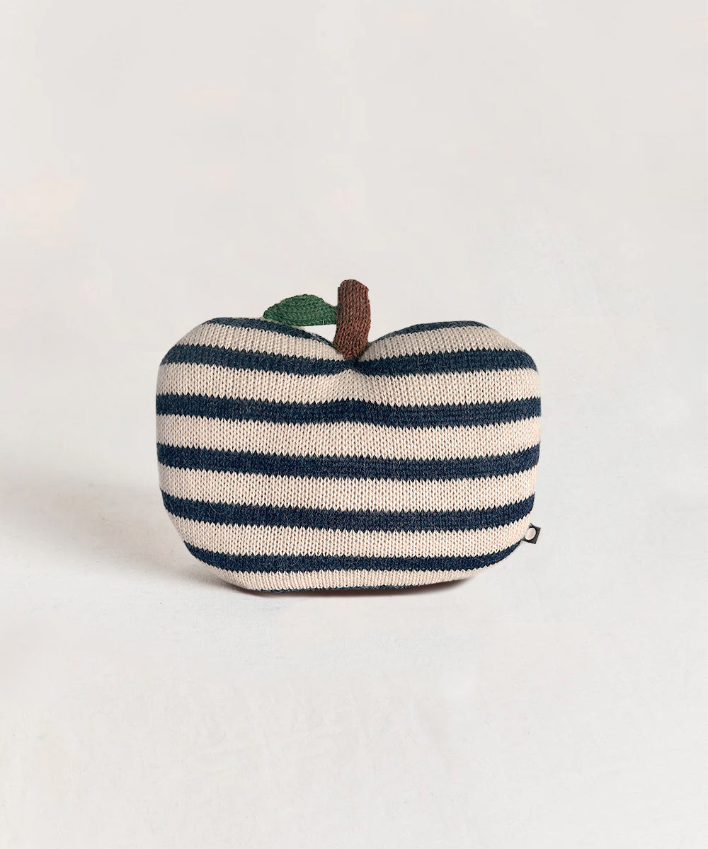 The Mini Apple Pillow features stripes and a small fabric leaf and stem, set against a plain background.