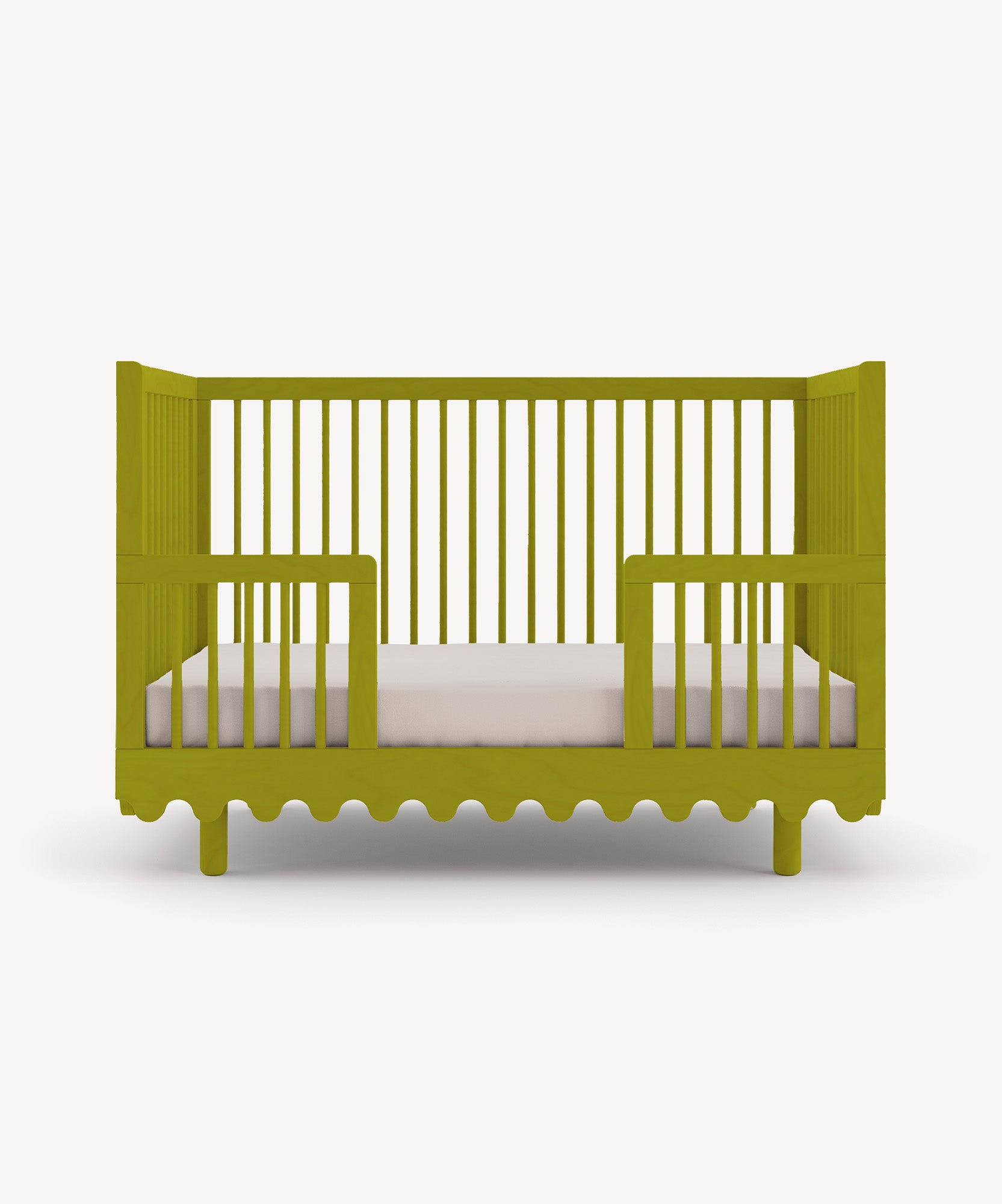 Moss Crib Conversion Kit: Green wooden crib with slatted sides and white mattress.