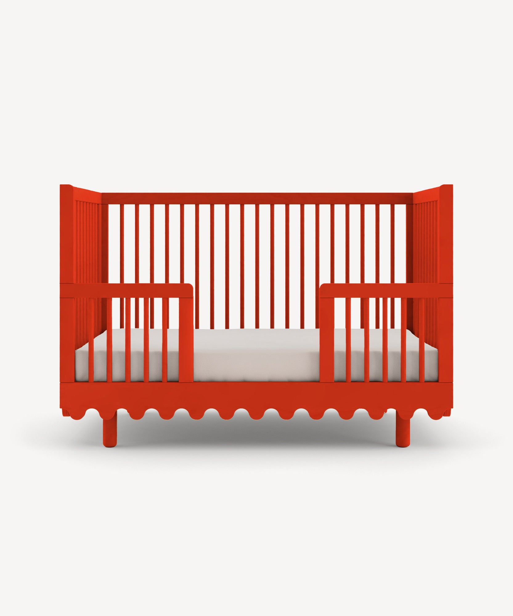 Moss Crib Conversion Kit: Red crib with a wavy base design and vertical slatted side panels against a white background.