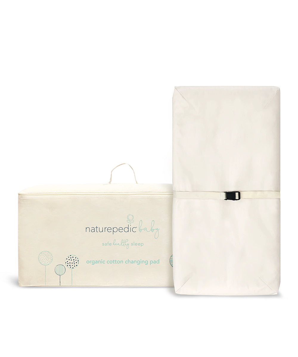 Naturepedic 4-Sided Changing Pad, organic cotton, white, with minimalist carrying case.