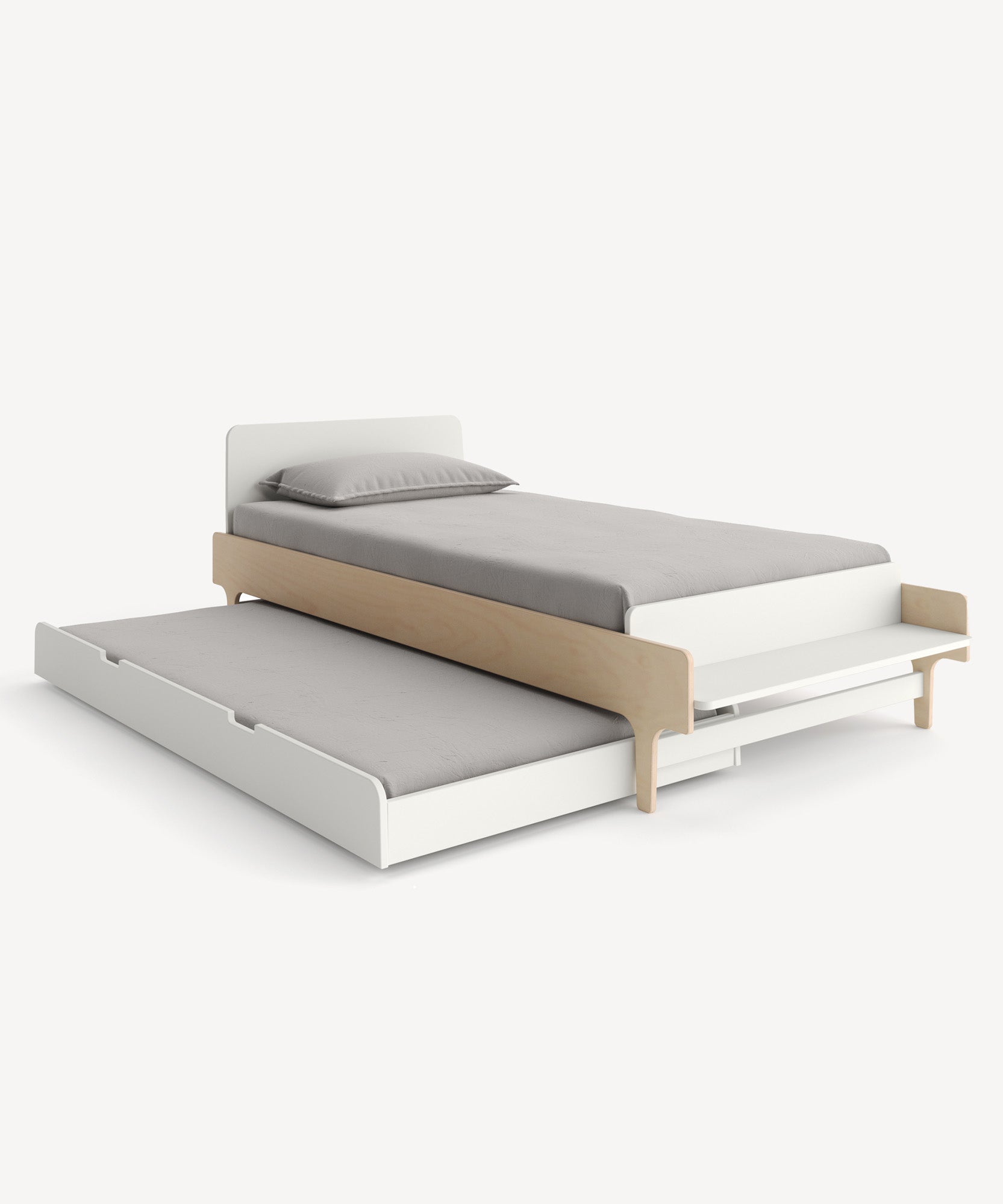 The River Twin Bed is a light wood and white frame bed with a pull-out trundle, featuring gray bedding.