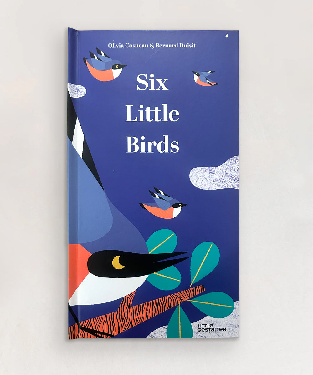 Blue book "Le Book - Six Little Birds" featuring colorful birds and leaves on the cover.