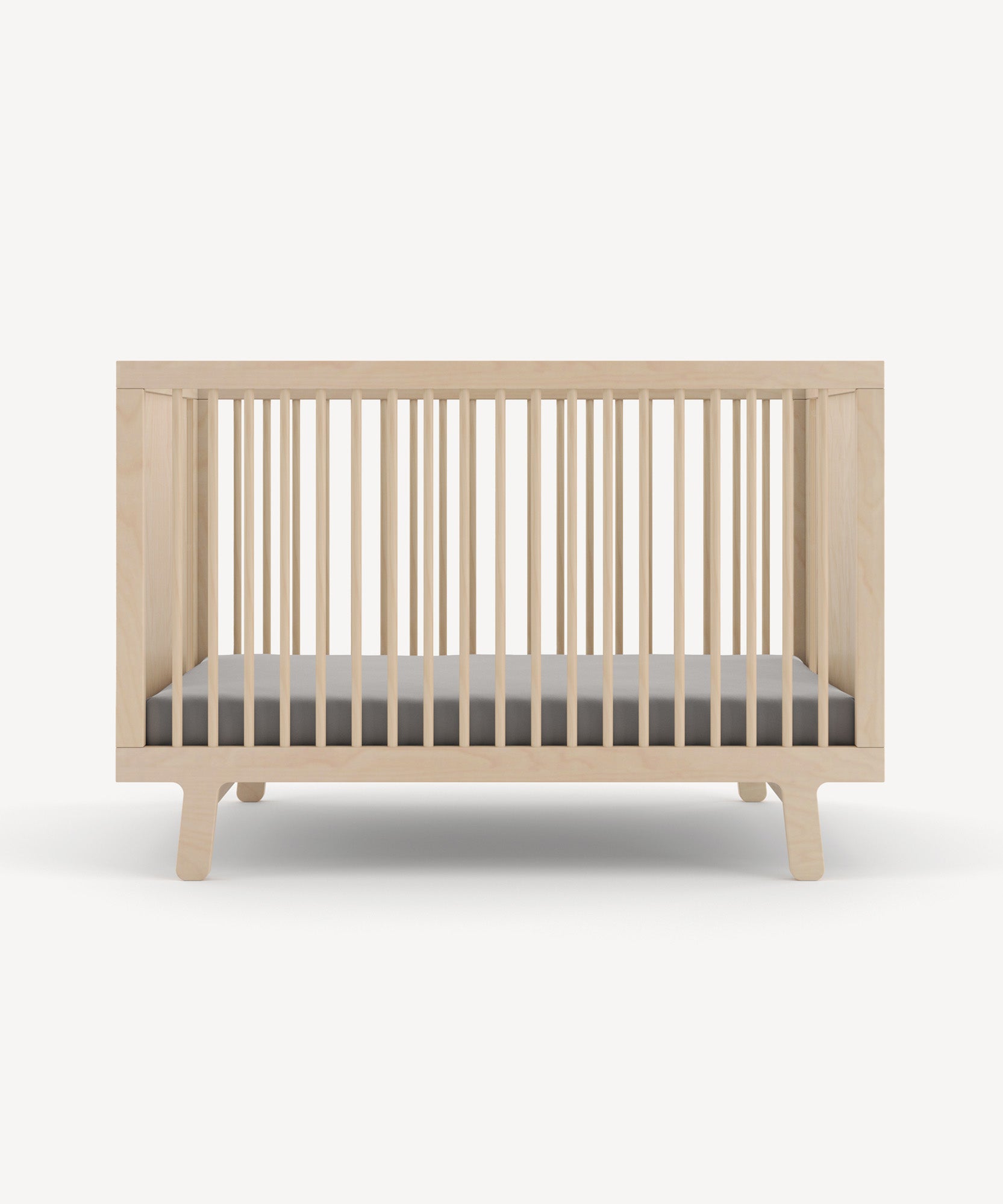 The Sparrow Crib features a wooden design with vertical slats on all sides and includes a gray mattress.