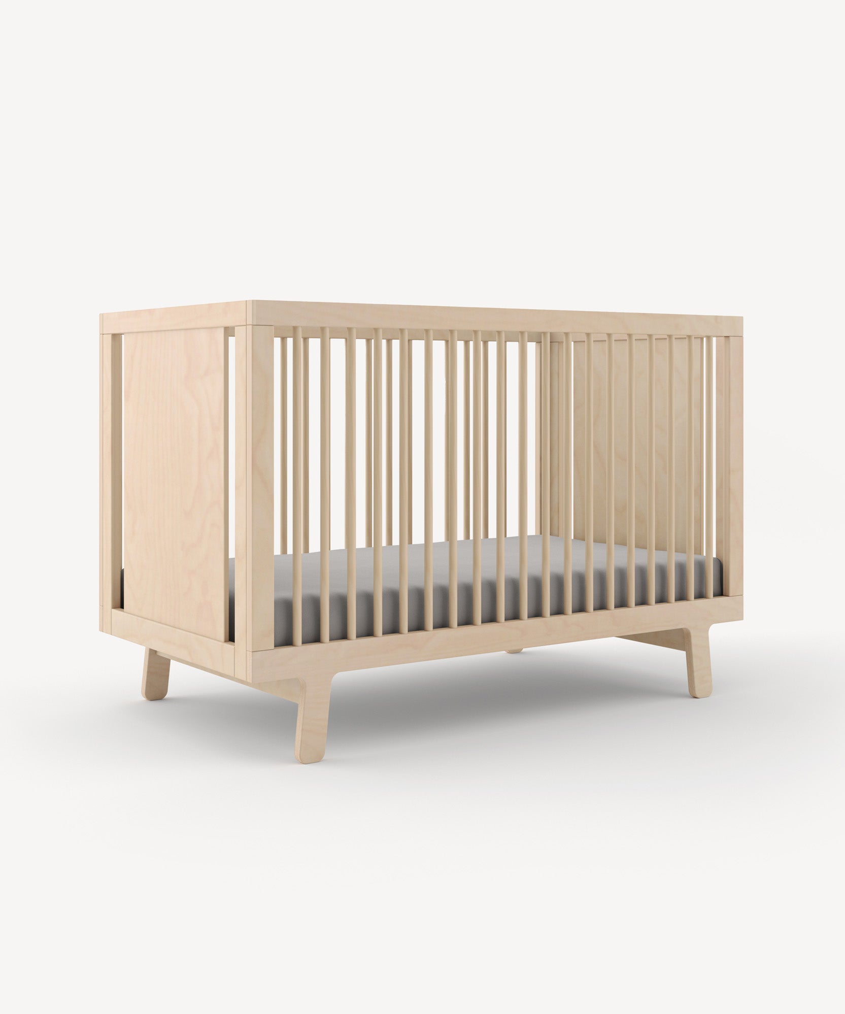 The Sparrow Crib features a wooden frame with slatted sides and includes a grey mattress, set against a white background.