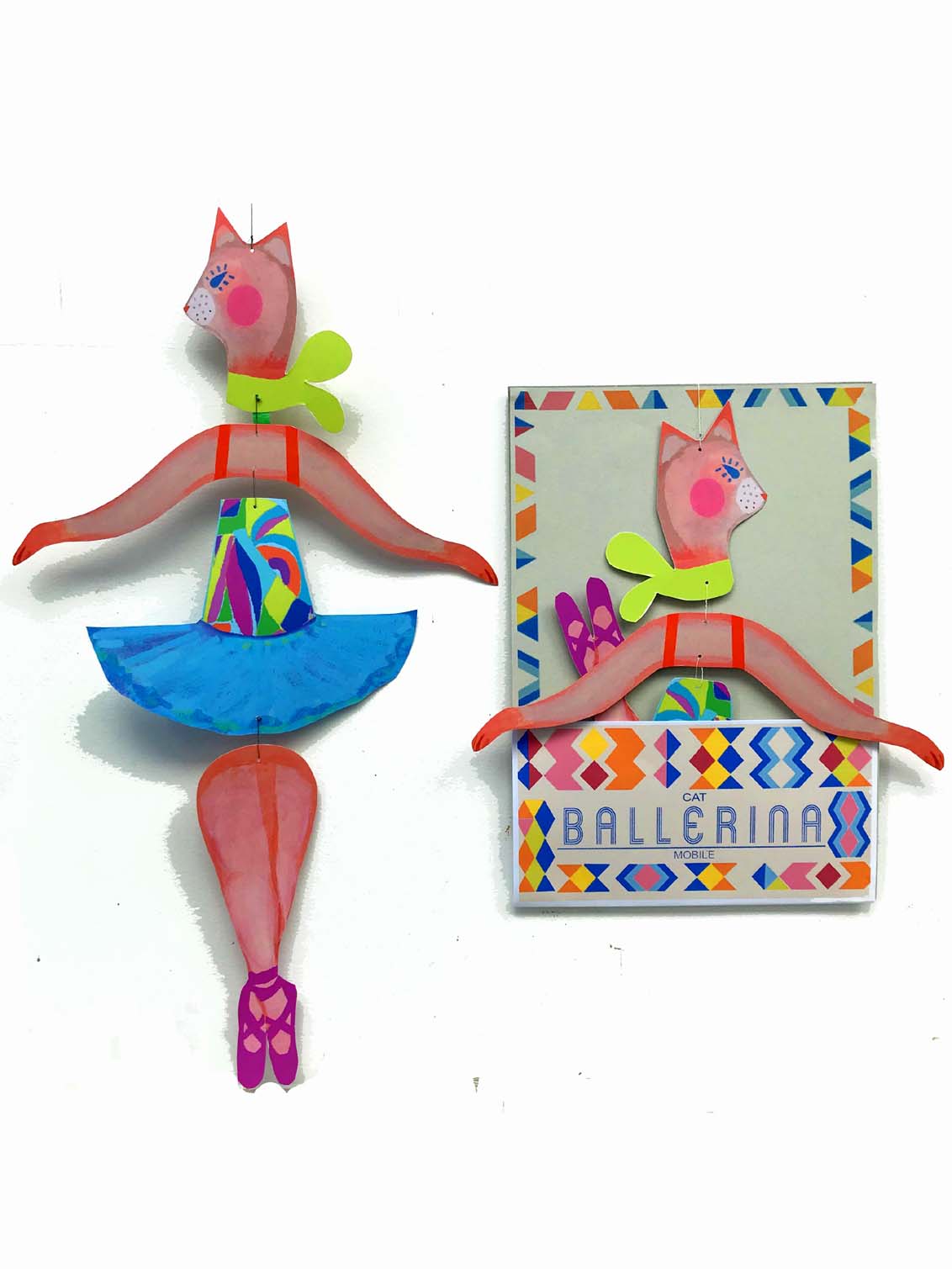 Two vibrant paper cat ballerinas, including Le Mobile - Cat Ballerina in a dancing pose and another framed, set against a white background.