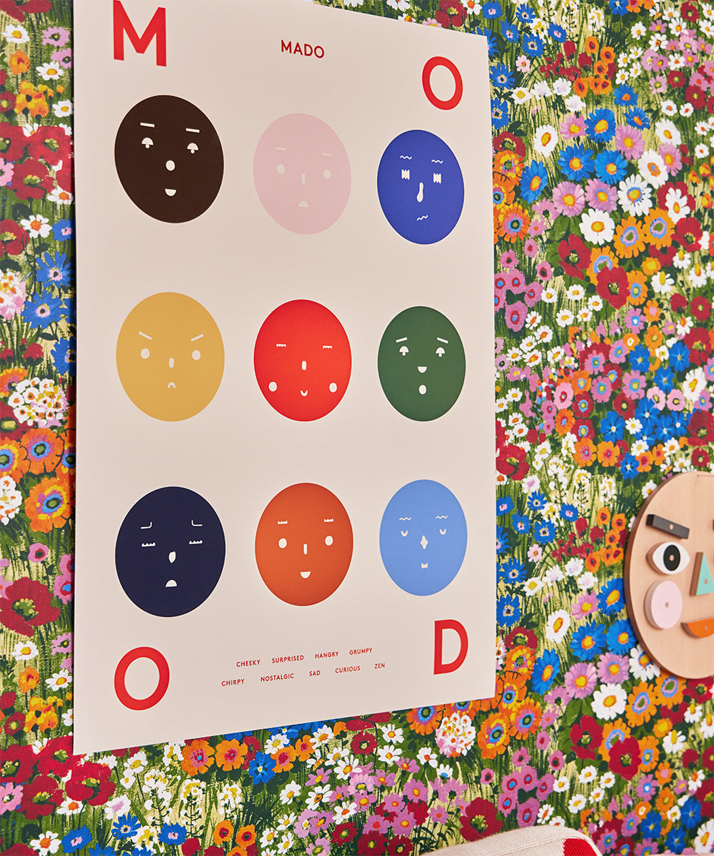 The Le Nine Moods Poster features nine colorful emoji faces against a floral wall background.